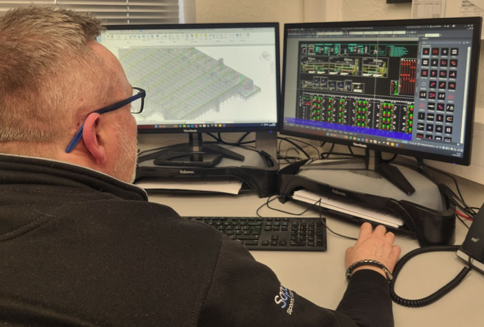 A member of the Sapoflow team doing design work at the office.